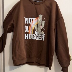 Brown Crewneck Sweater with Cactus Graphic “Not A Hugger”
